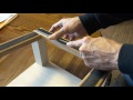 Inserting a gripper strip into a rug hooking frame