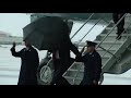 Donald Trump gets smacked by umbrella....