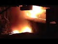 Steel mill EAF Pushing unmelted scrap into the liquid bath