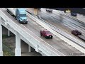 Vehicles struggle on icy Houston freeway interchange flyover