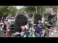 Massed Pipes & Drums parade through Deeside town to start the Ballater Highland Games 2018