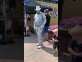 Yellow Boots stealing Silver Living Statue’s thunder. (My son). #livingstatue #busker #streetart