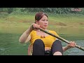 The girl lives alone under a bamboo roof floating on the lake surface fishing for a living.