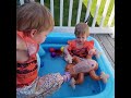 Twins play in their mini pool