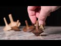 Making wooden spinning tops
