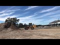 John Deere 544k pushing up dirt pile