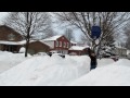Mr. John Hush shovels snow with a large scoop