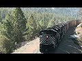 130-car coal train w/ double helpers crosses Greenhorn Trestle, Mullan Pass MT.