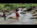 A single mother cleared the fields and took her two children to bathe in the stream