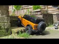 RC CARS. Ford Bronco Traxxas Trx4 rc car trying to climb the stairs and failed.