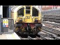 London Underground Battery-Electric locomotives pass Barons Court for Ruislip Depot