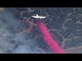 WATCH: Texas airtankers drops fire retardant to help contain fire in Palo Pinto County