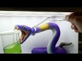 Diorama of extracting venom from realistic Pokemon