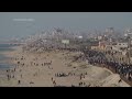 Palestinians in central Gaza wait for aid trucks to roll off pier built by US