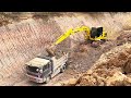 working excavator loading amazing trucks