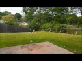 HPI Savage xs jumping and running in the grass