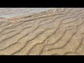 Flowing water over beach